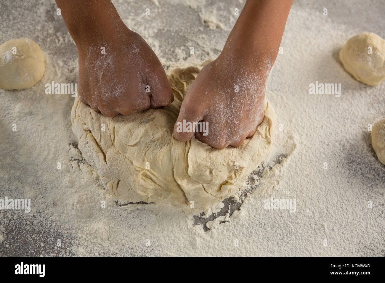 Close-up of woman kneading a dough Stock Photo - Alamy