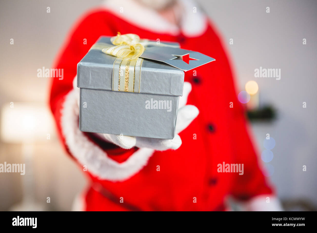 Close-up of santa claus giving a gift Stock Photo