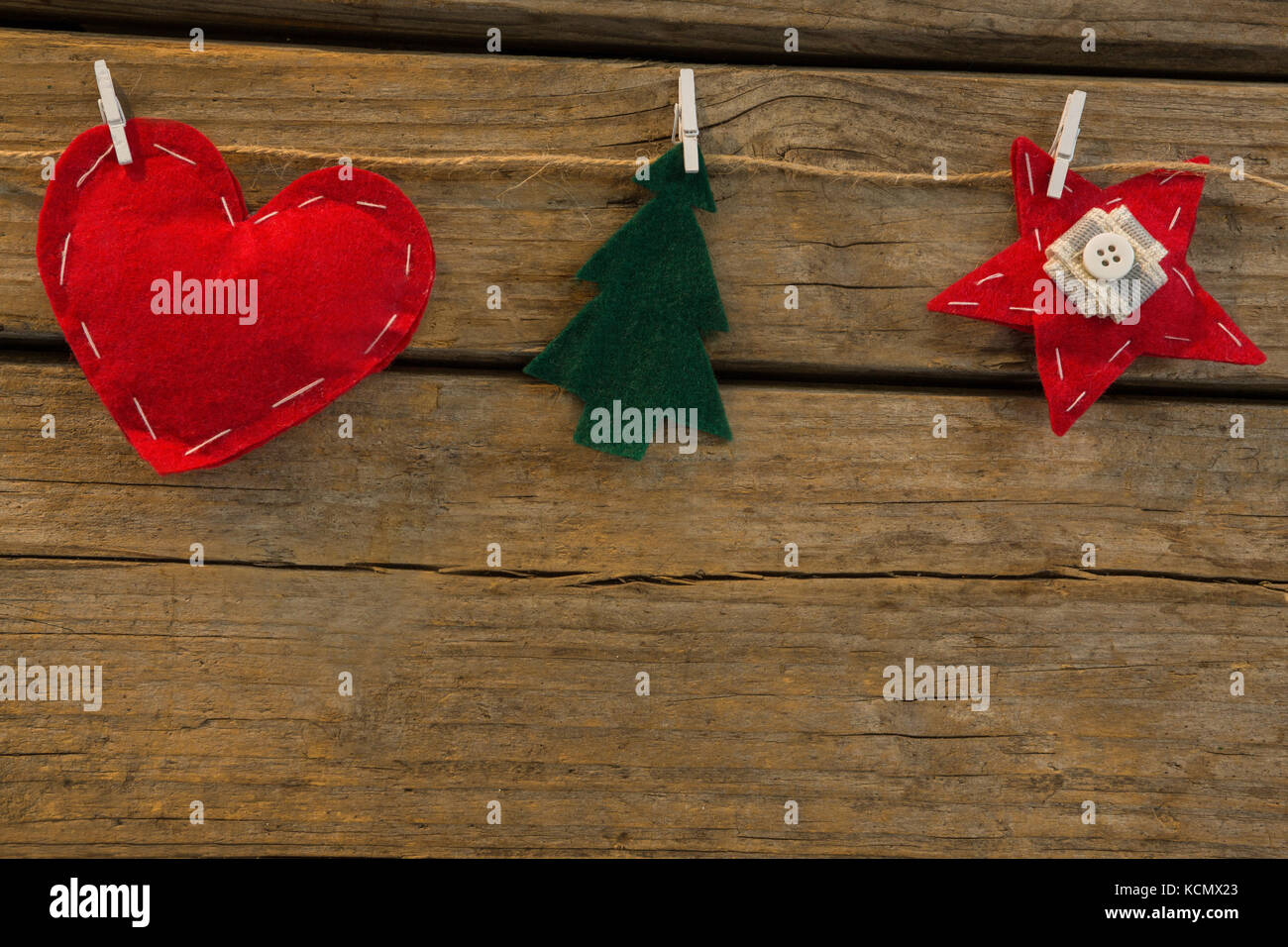 Close Up Of Various Shapes Christmas Decoration Attached With Rope