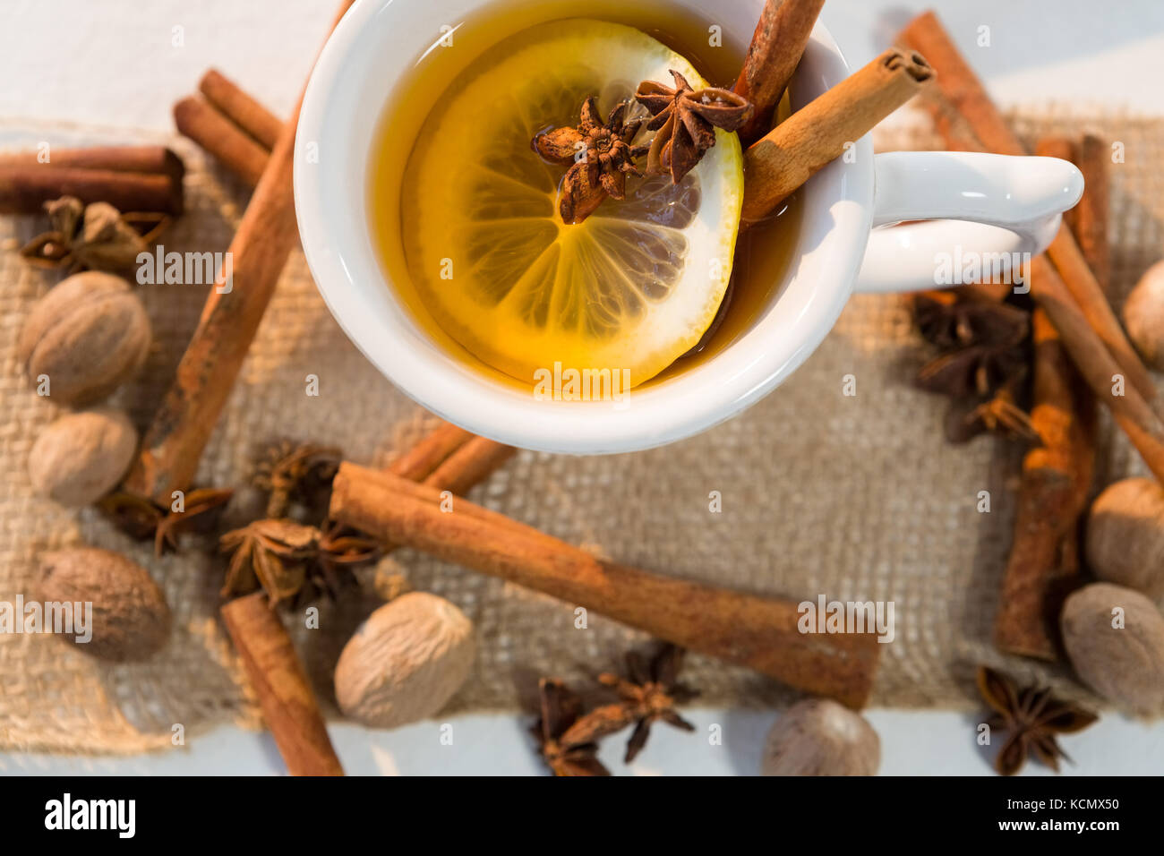 Close-up of spice tea with various ingredients on white background ...