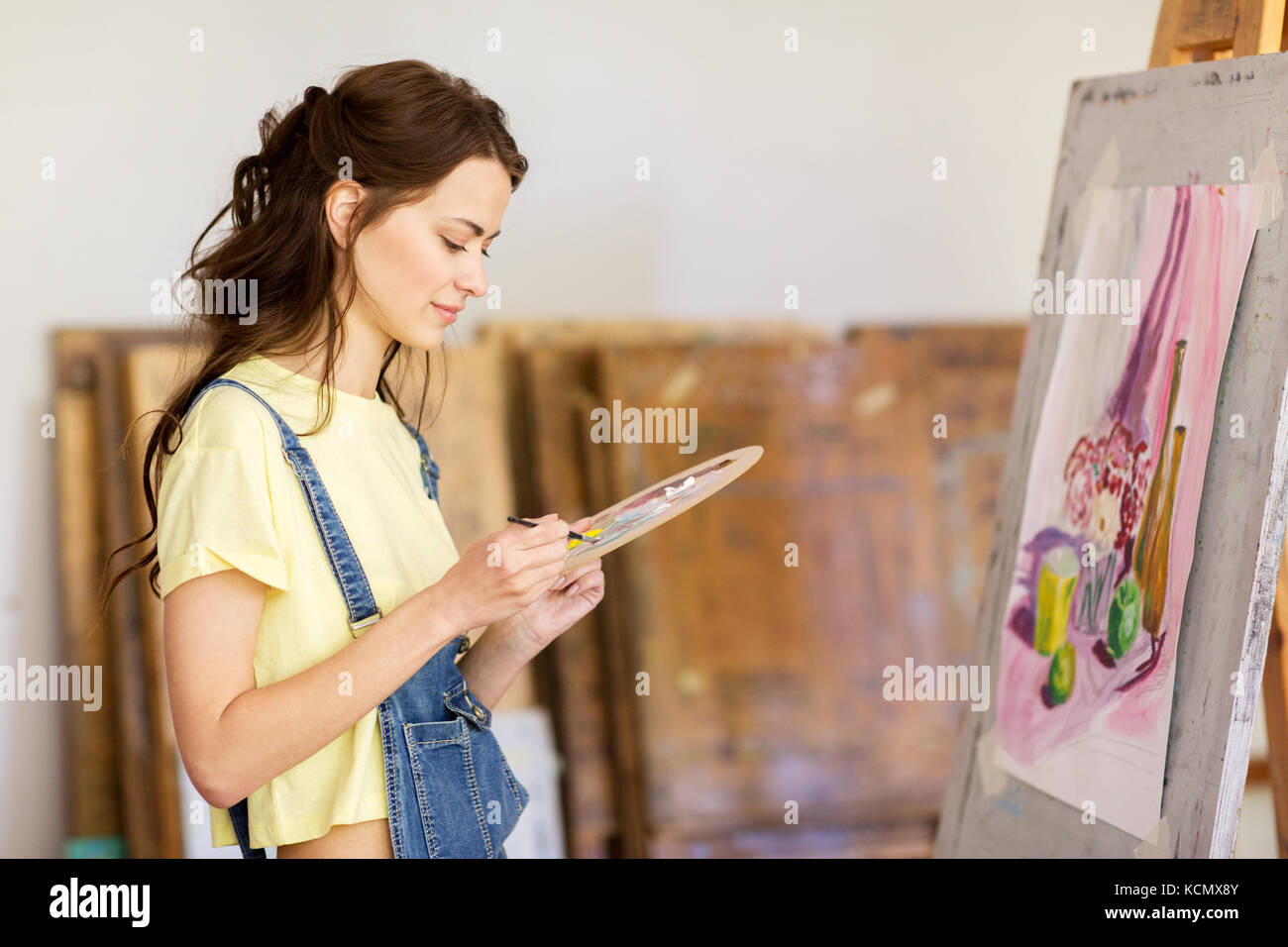 student girl with easel painting at art school Stock Photo - Alamy