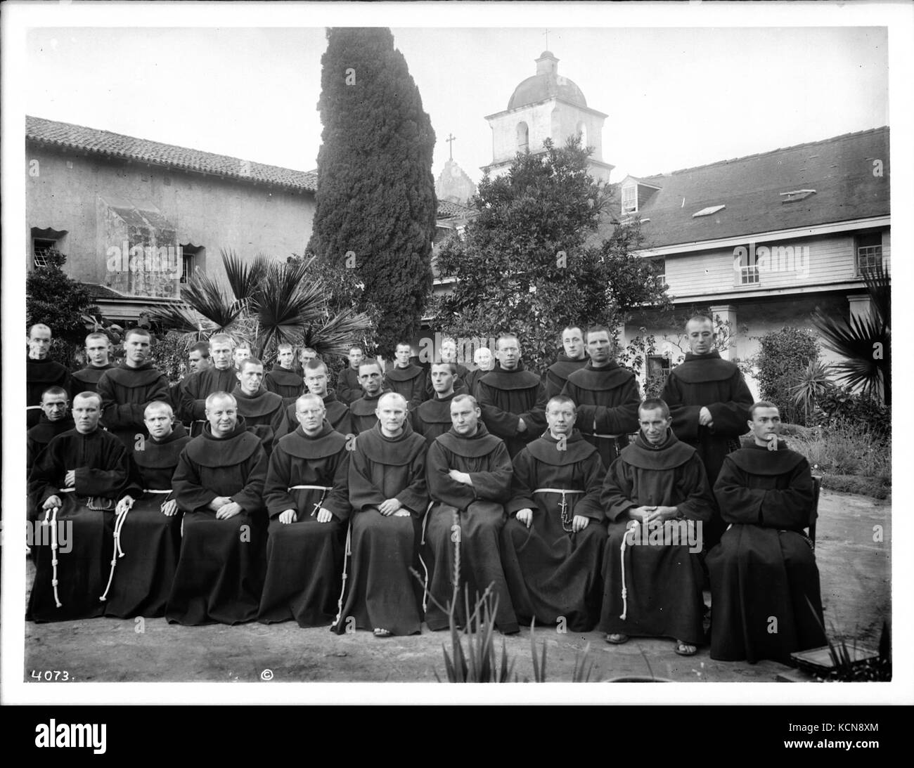 Group portrait of about 30 Franciscan monks outside at Mission Santa Barbara, California, 1904 (CHS 4073) Stock Photo