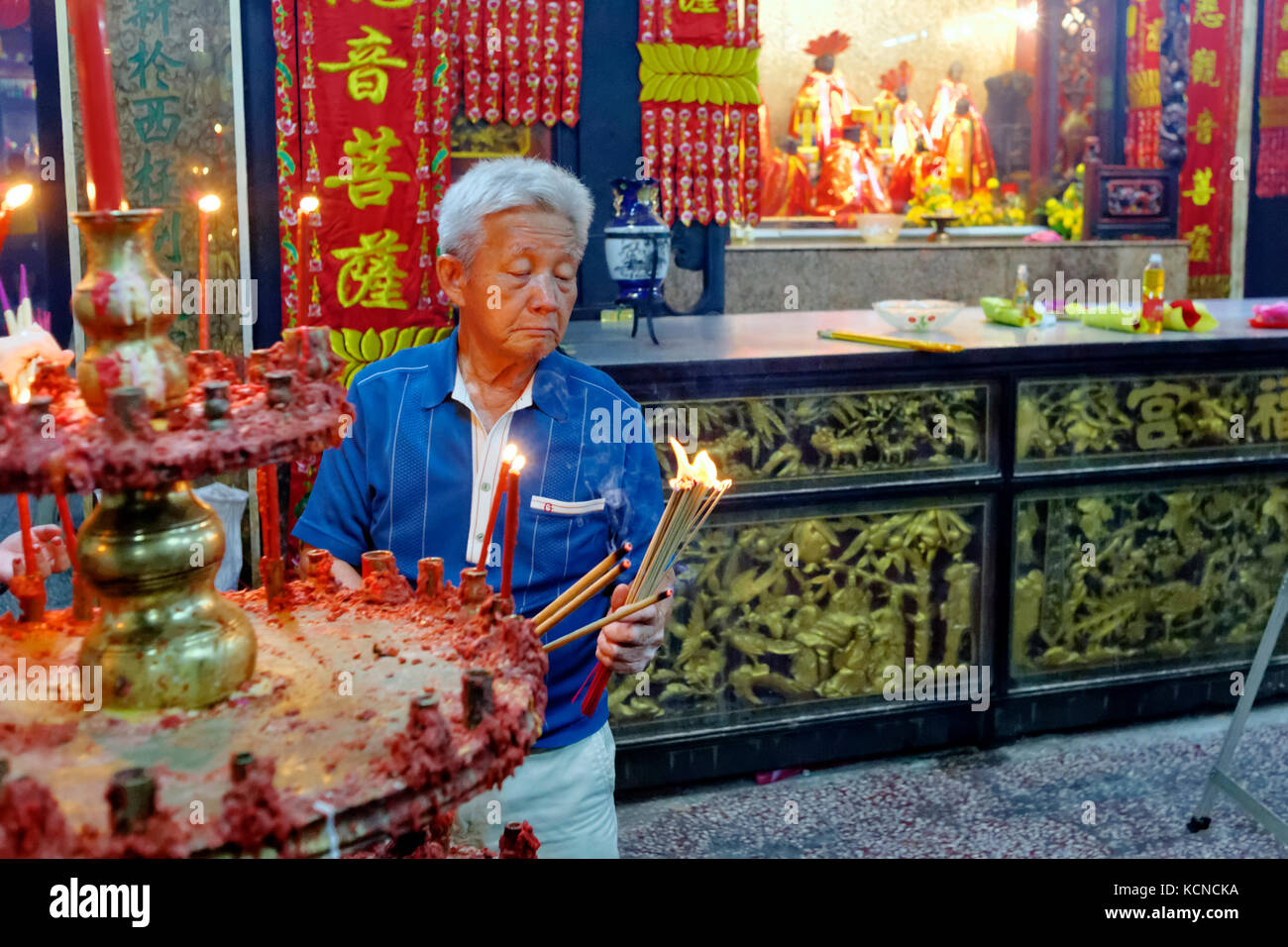 offerings incense sticks and pray inside of  the Goddess of Mercy Temple during chinese new year in George Town, Penang, Malaysia Stock Photo