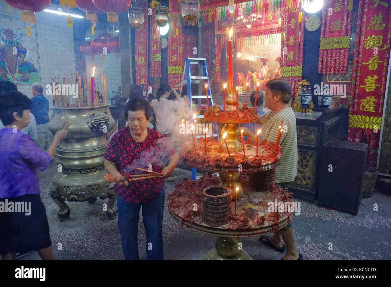 offerings incense sticks and pray inside of  the Goddess of Mercy Temple during chinese new year in George Town, Penang, Malaysia Stock Photo