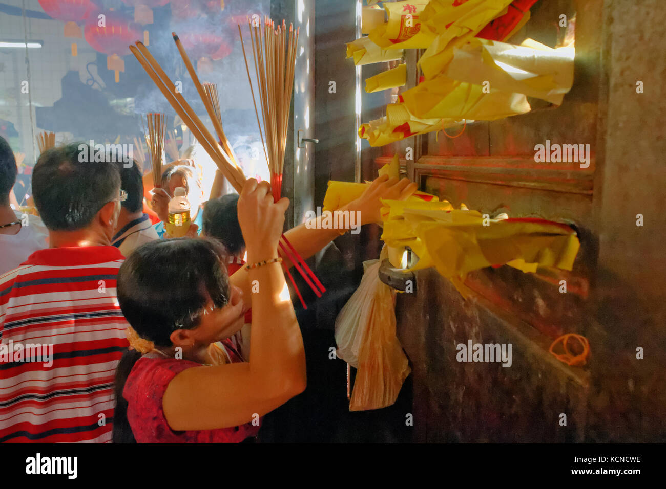 offerings incense sticks and pray inside of  the Goddess of Mercy Temple during chinese new year in George Town, Penang, Malaysia Stock Photo