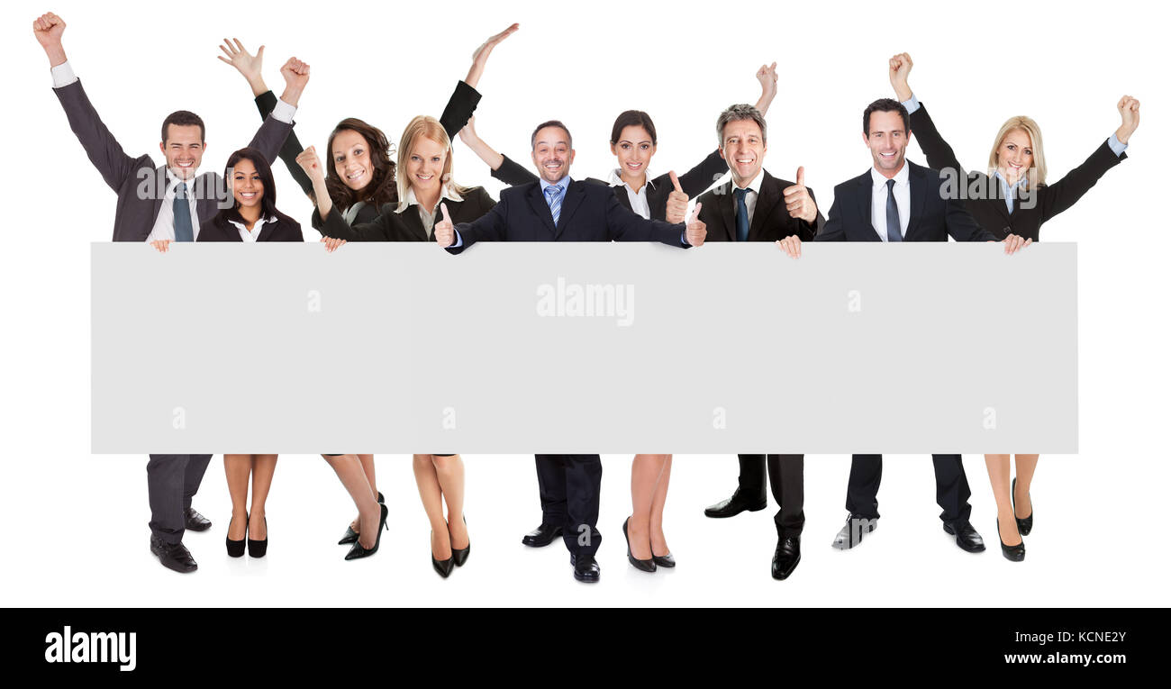 Group of excited business people presenting empty banner. Isolated on white Stock Photo