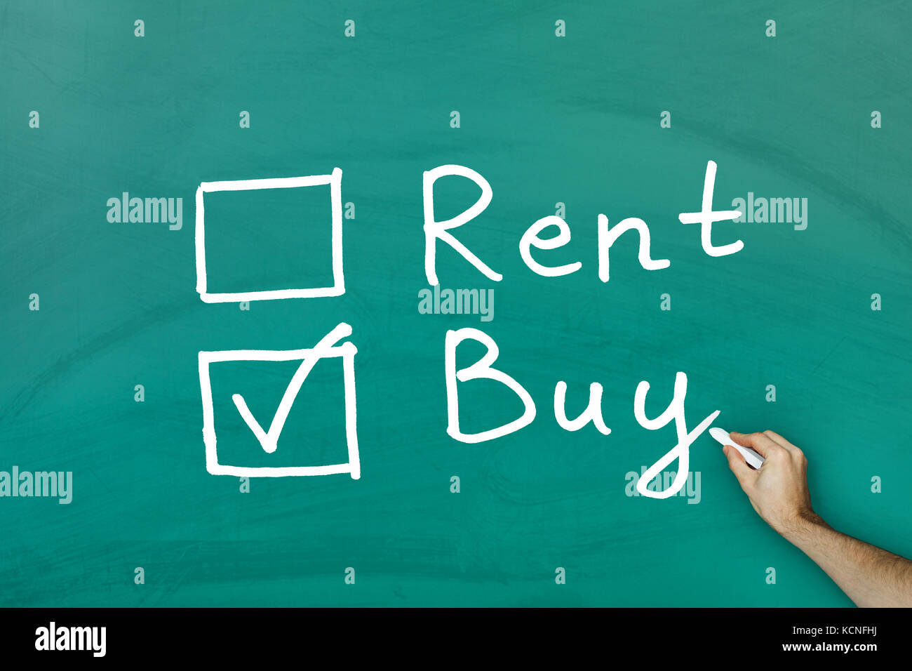 Buy not rent concept on green blackboard Stock Photo