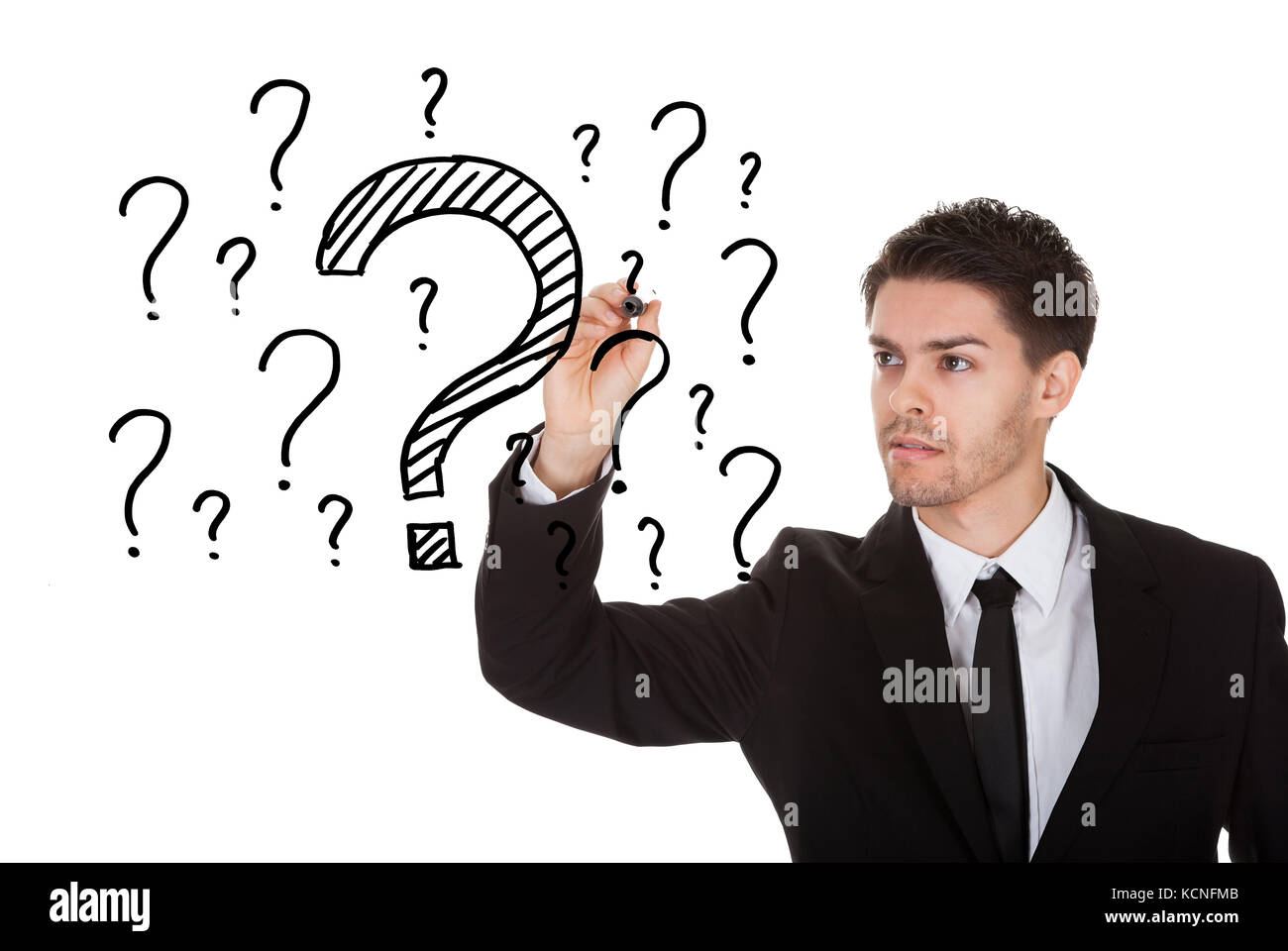 Man writing lots of questions on white screen Stock Photo