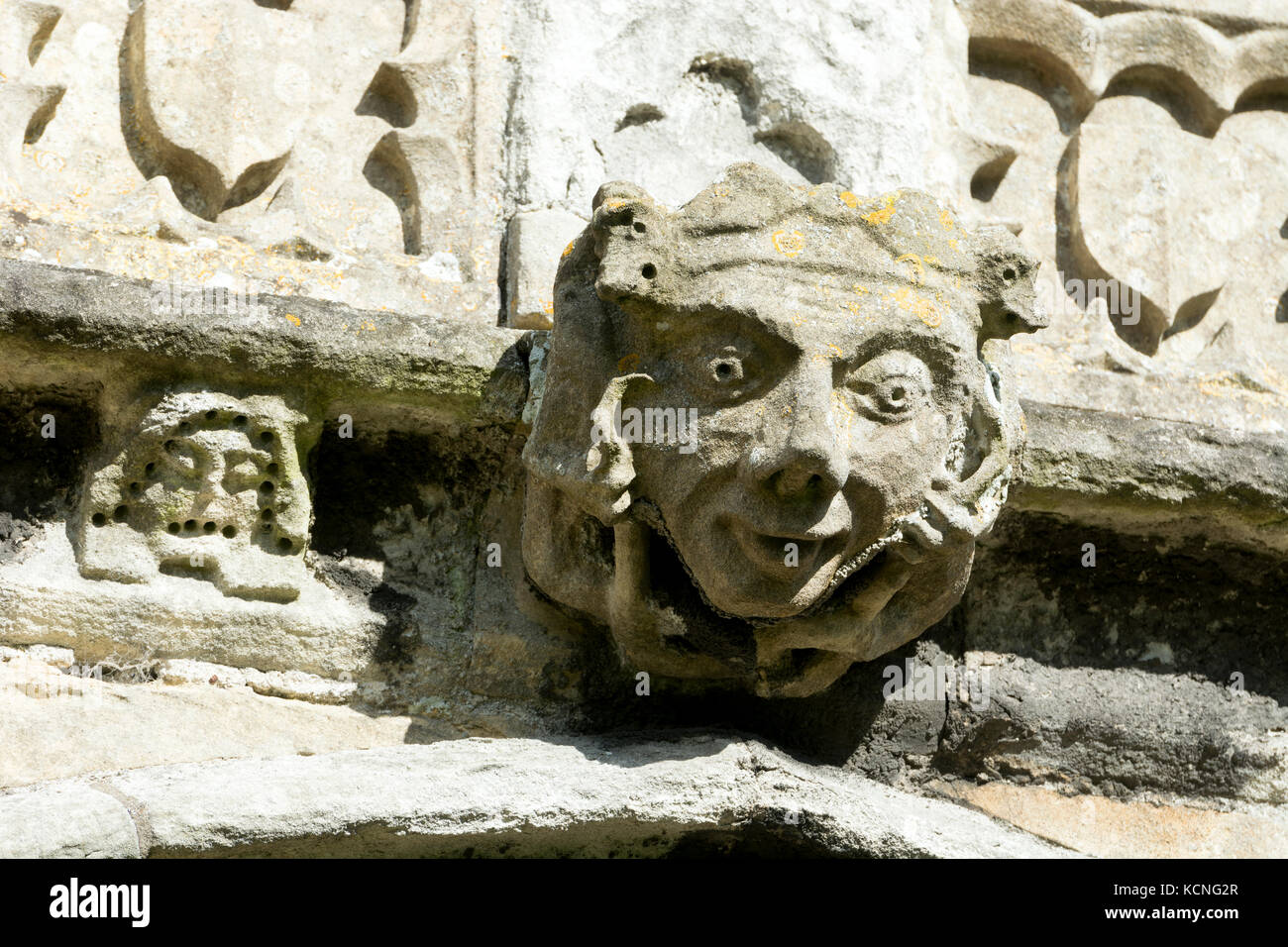 Carved head on the outside of All Saints Church, Sutton on Trent, Nottinghamshire, England, UK Stock Photo