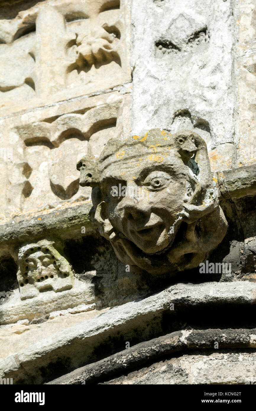 Carved head on the outside of All Saints Church, Sutton on Trent, Nottinghamshire, England, UK Stock Photo