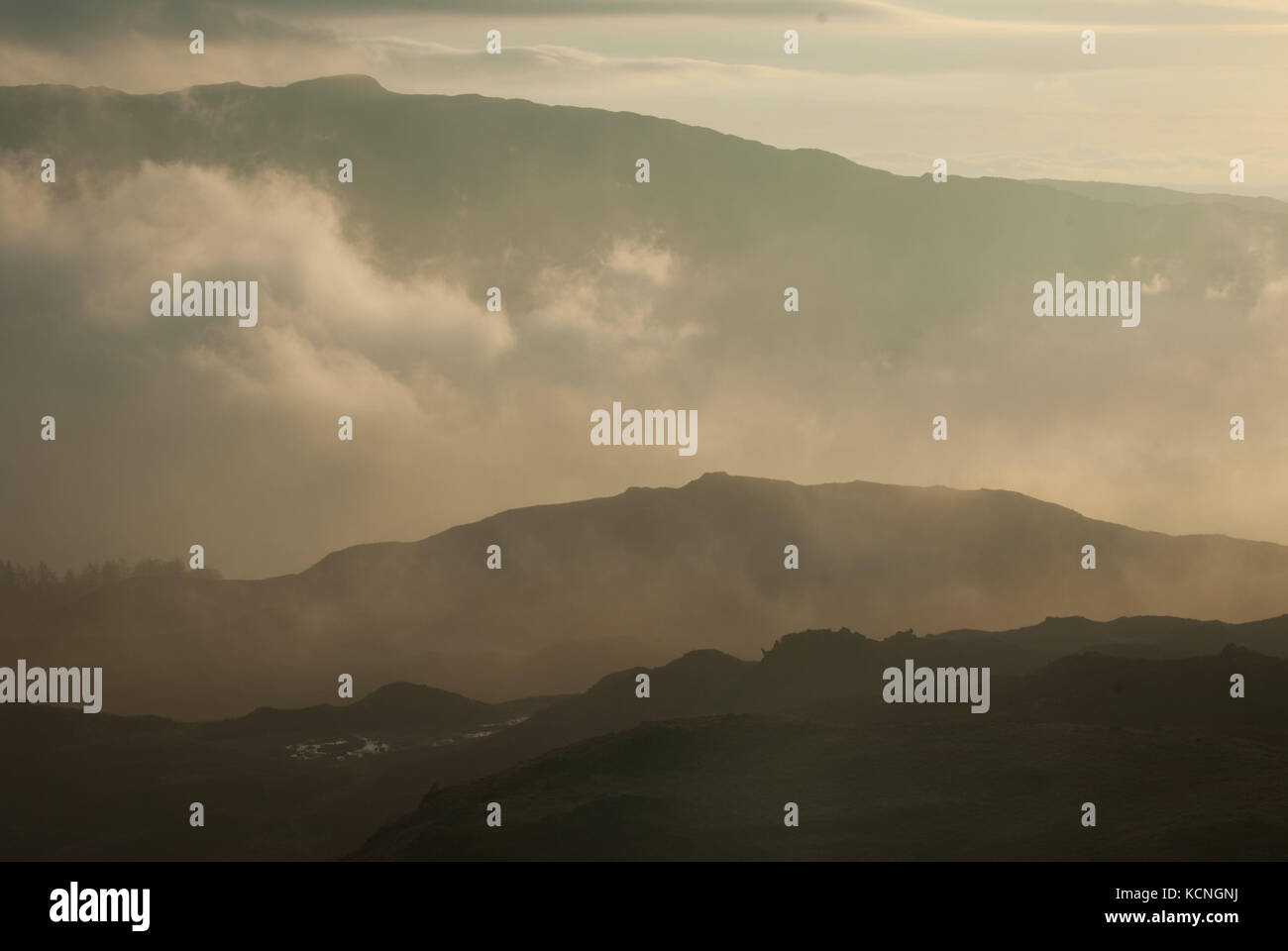 Dawn over Loughrigg with Wansfell in distance, near Ambleside, Lake District National Park, UK Stock Photo