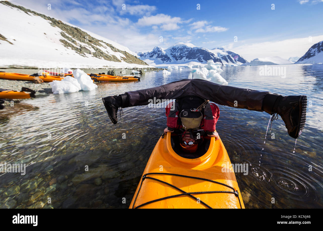 A Kayak guide demonstrates his unique balancing abilities with his Kayak while paddling in Danco Harbour, The Aantarctic Peninsula, Antarctica Stock Photo