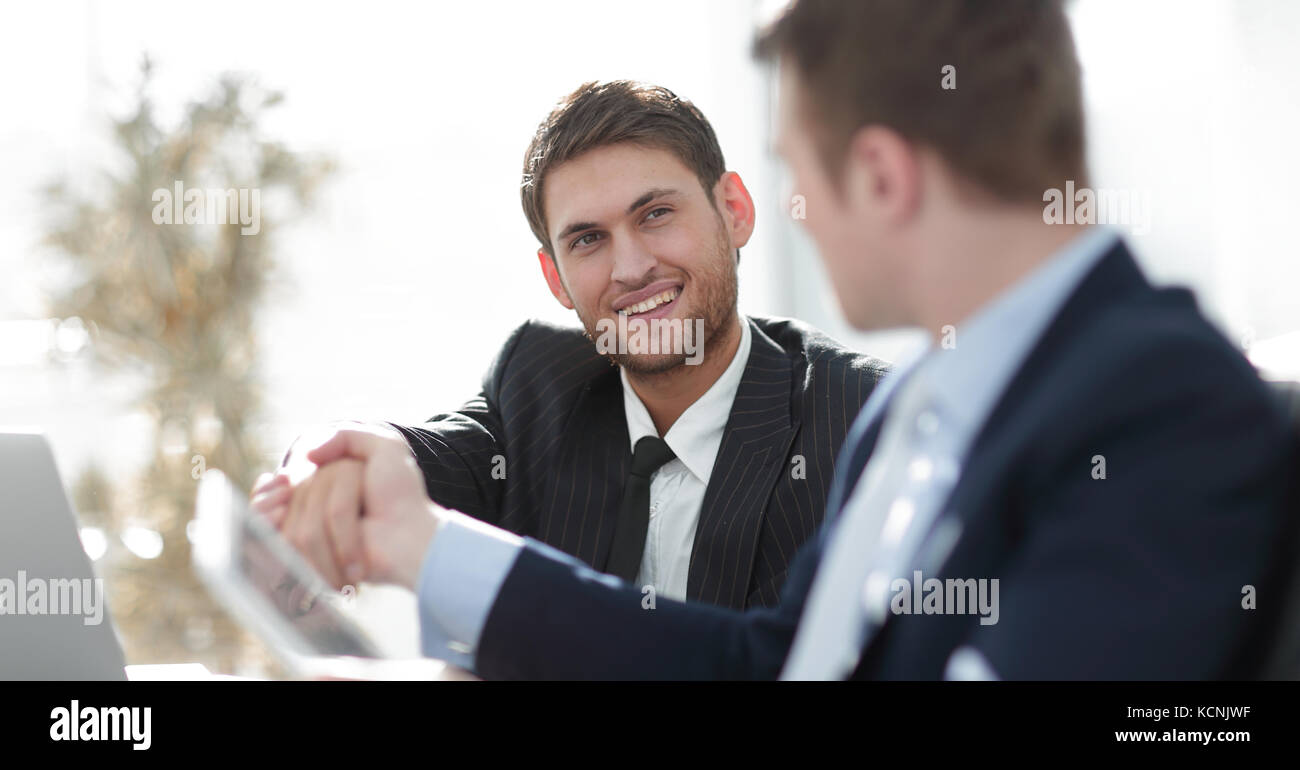 closeup.side view.the handshake business partners at your Desk Stock Photo Alamy