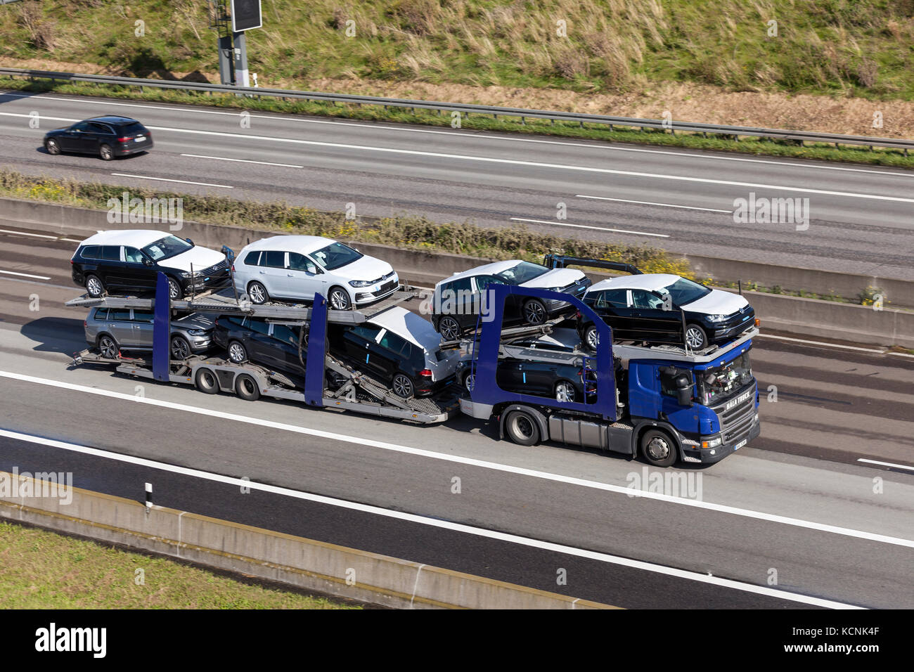 Frankfurt, Germany - Sep 19, 2017: Scania P410 car transporter hauls new Volkswagen Golf cars along the A45 highway in Germany Stock Photo