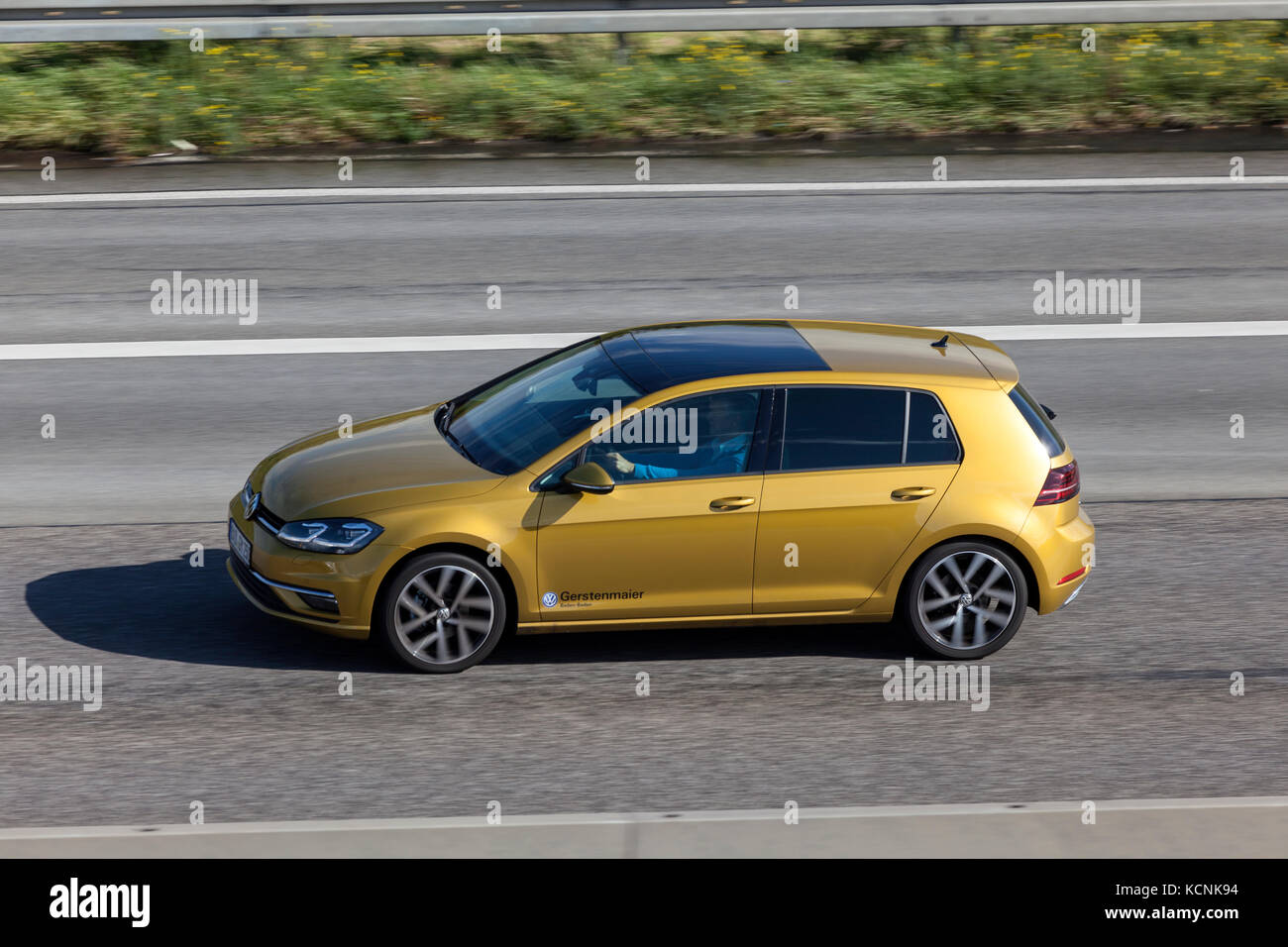 Frankfurt, Germany - Sep 19, 2017: Golden Volkswagen Golf VII hatchback  driving on the highway in Germany Stock Photo - Alamy