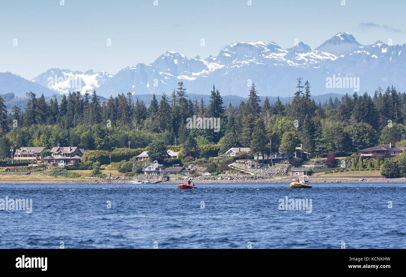Whale watching boats float down Discovery Passage in search of Humpback Whales, Campbell River, Vancouver Island, British Columbia, Canada Stock Photo