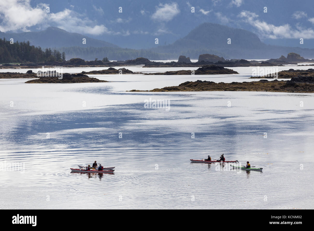 Kayakers take to the waters surrounding Spring Island near Kyuquot, Vancouver Island, British Columbia, Canada Stock Photo