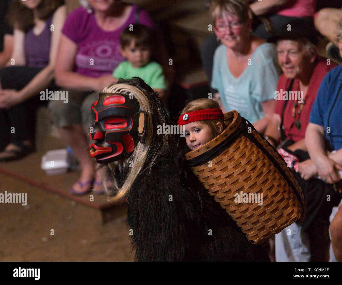 Dzunakwa, Wild woman of the woods and the keeper of children in first nation lore dances for visitors to the Komok's bighouse, Comox, Vancouver Island, British Columbia, Canada. Stock Photo