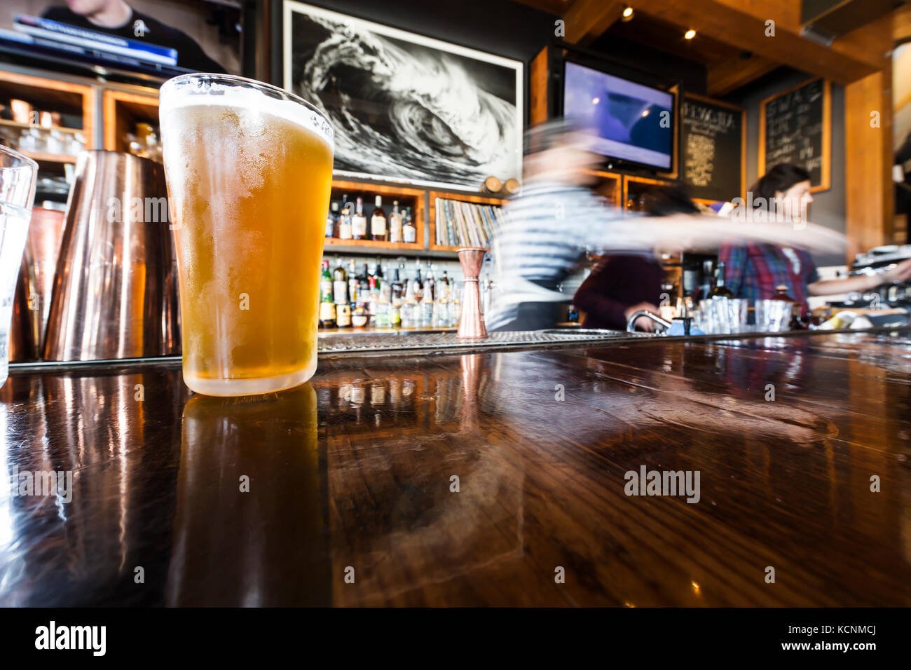 Craft beer is served cold at a local restaurant in Tofino, Pacific Rim, Vancouver Island, British Columbia, Canada. Stock Photo