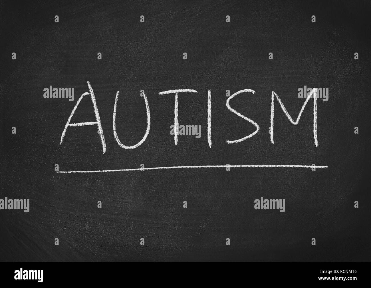 autism concept word on a blackboard background Stock Photo
