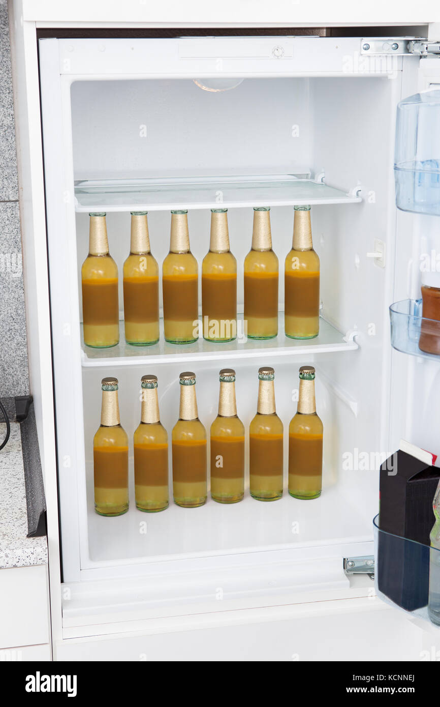 Bottles of alcoholic beer kept in a row Stock Photo