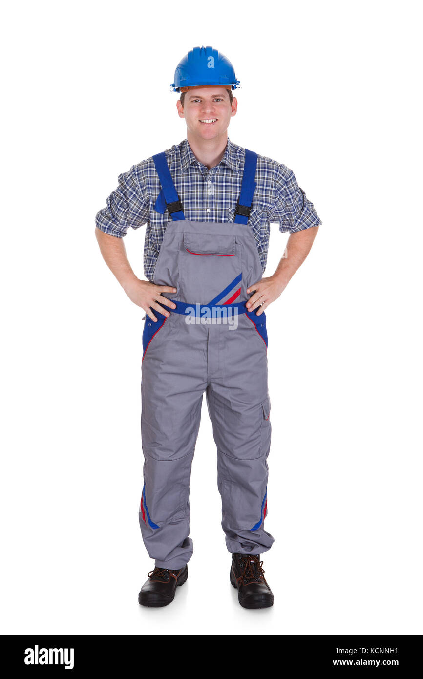 Happy male construction worker standing on white background Stock Photo