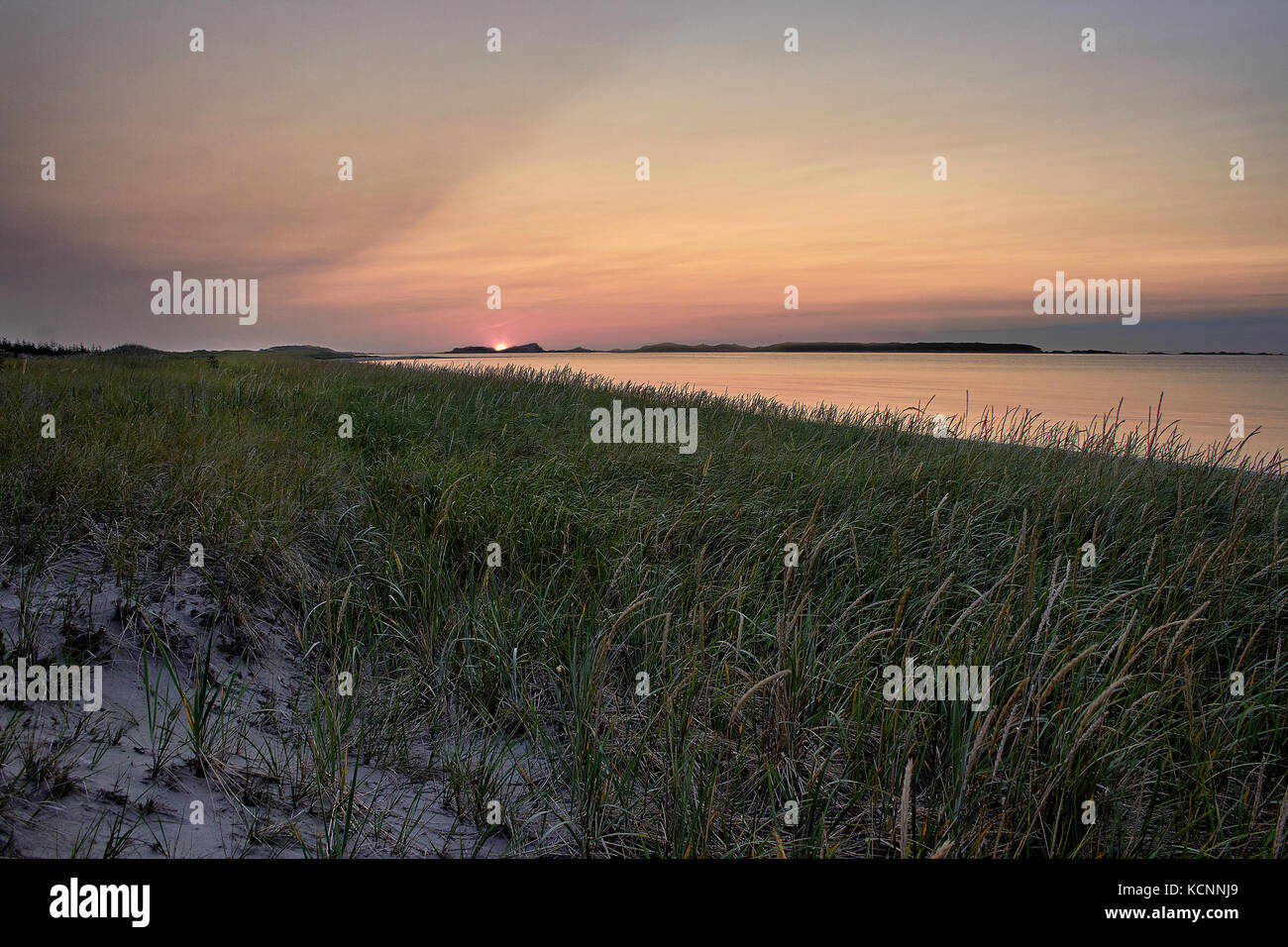 Sunset on the sandy beach Shallow Bay, Cow Head, Gros Morne National Park, Newfoundland & Labrador Stock Photo