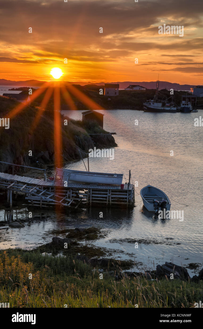 Sunrise over fishing stages on changeIslands,Change Islands, Newfoundland & Labrador Stock Photo