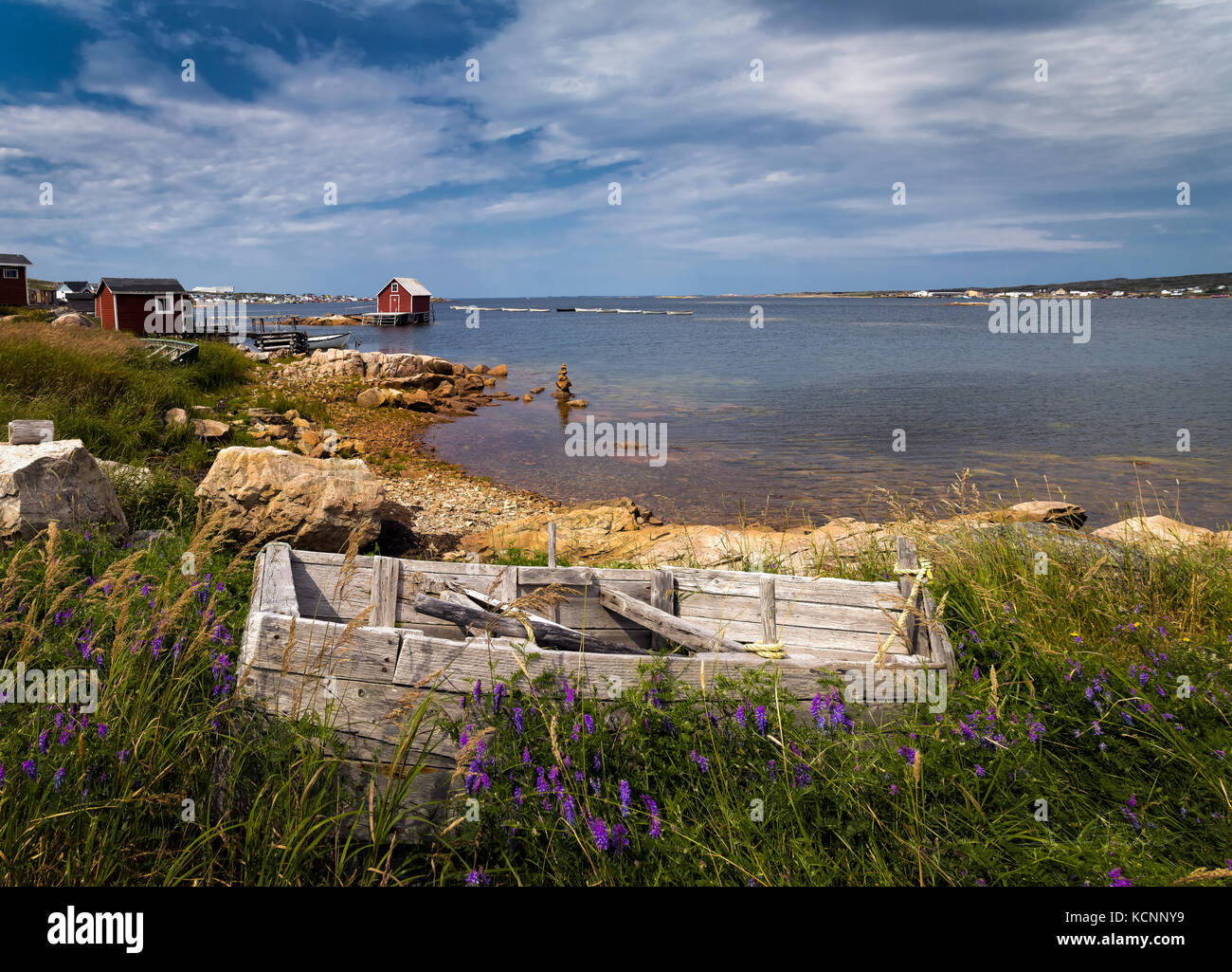 old Fishing stage and dorey, view of famous fogo island inn in distance
