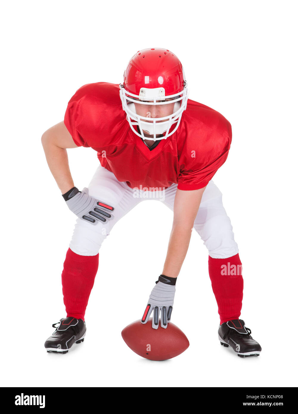 American Football Player With Rugby In Pose Over White Background Stock Photo