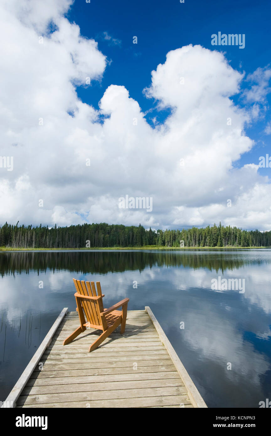 chair on dock, Two Mile Lake , Duck Mountain Provincial Park, Manitoba, Canada Stock Photo