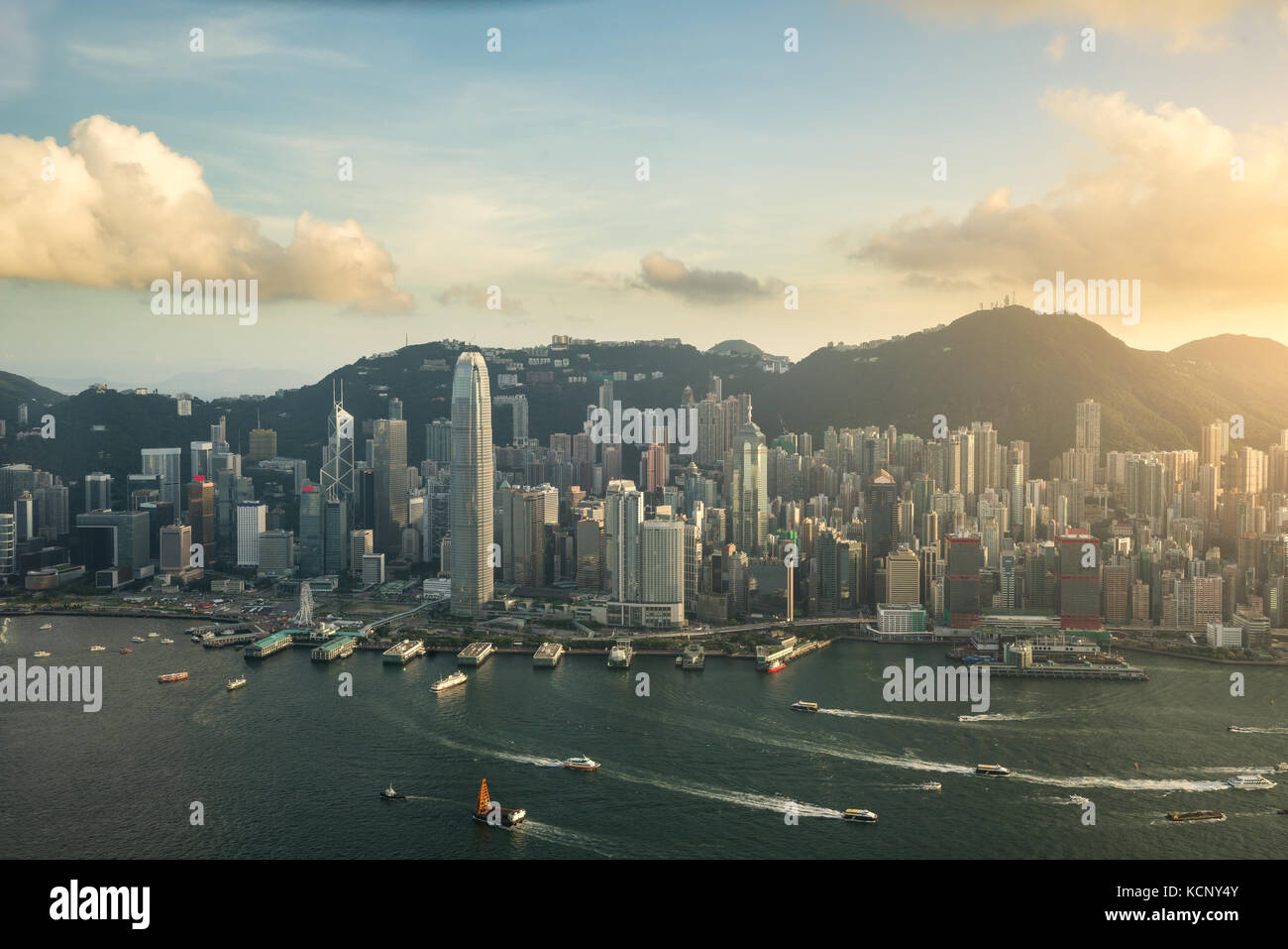 Aerial view of Hong Kong skyline and Victoria Harbor with blue sky in ...