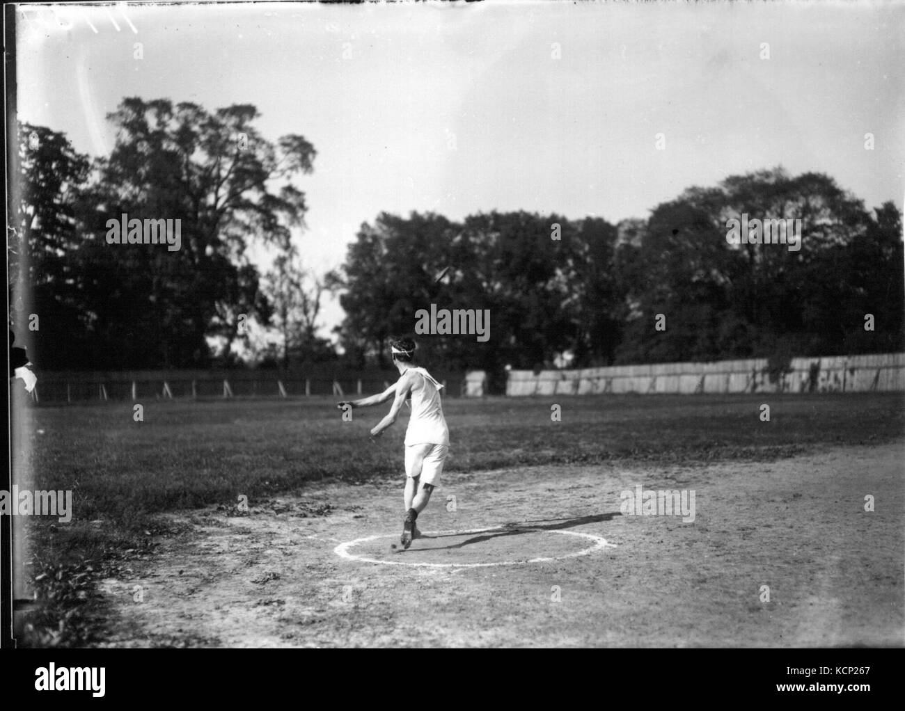 Discus throwing event at high school track meet 1912 (3190898193 Stock
