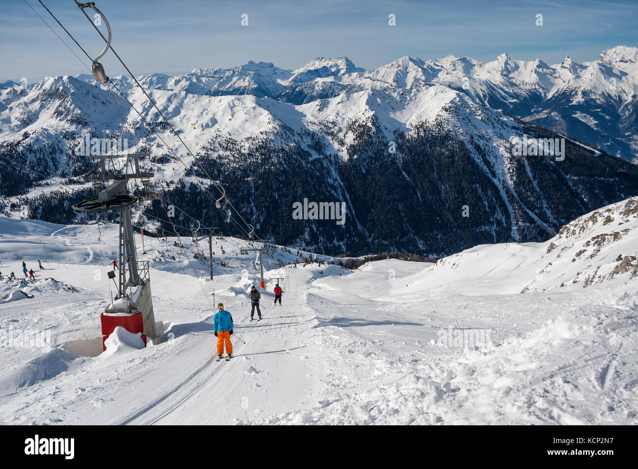 4 VALLEY, SWITZERLAND - FEBRUARY 04, 2010: Ski resort in the Swiss Alps. Skiers ascend on rope tow up Stock Photo