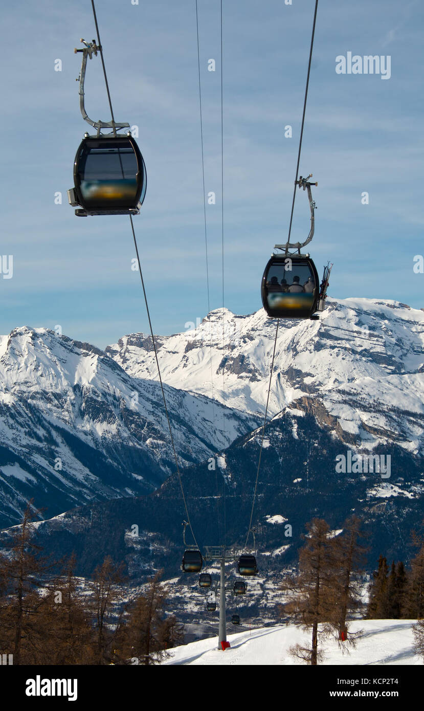 Rope-way against a background of snow-capped peaks, Alps Stock Photo ...