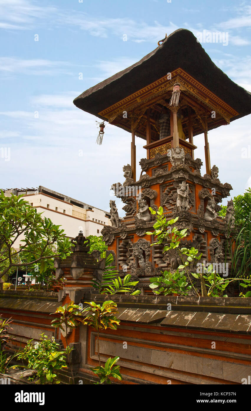 Traditional Balinese temple on the street  in Kuta Stock Photo