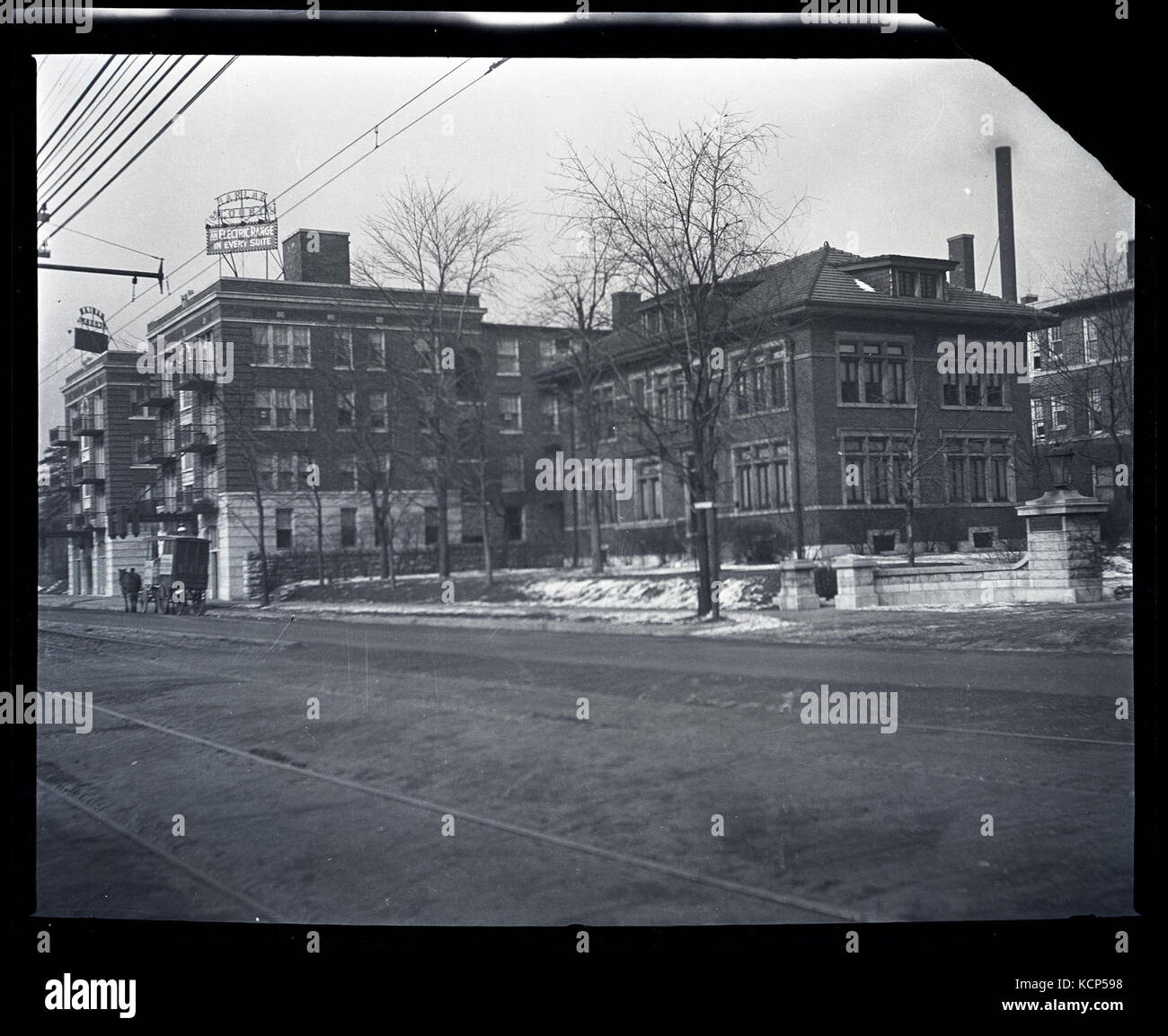 Harlan Court Apartments and a neighboring house at 5457 Delmar