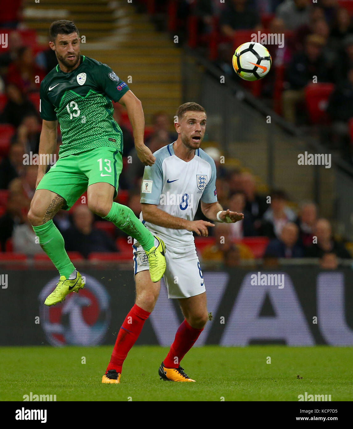 Bojan Jokic of Slovenia and Jordan Henderson of England during the FIFA World Cup Qualifier match between England and Slovenia at Wembley Stadium in London. 05 Oct 2017 Stock Photo