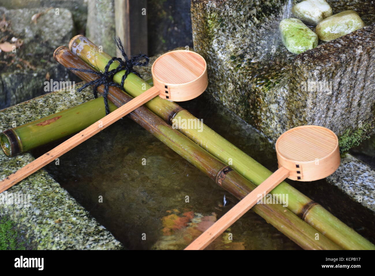 Japanese fountain and bamboo ladles used for washing hands at the ...