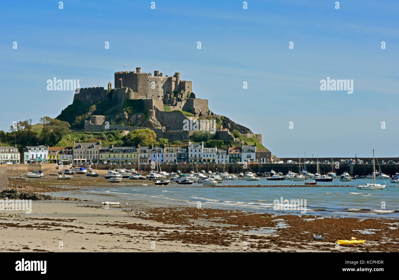 Mont Orgueil - Gorey - Jersey Channel Isles - ancient castle overlooking Gorey harbour - sunlight and shadows - incoming tide Stock Photo