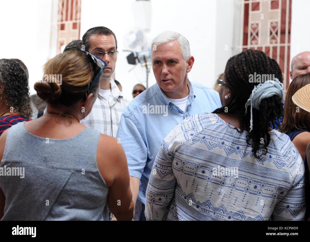 St Croix, USA. 6th Oct, 2017. U.S. Vice President Mike Pence greets parishioners outside the Holy Cross Episcopal Church October 6, 2017 in Christiansted, St. Croix, US Virgin Island. Pence is in the Virgin Islands to view relief efforts following destruction from Hurricane Maria. Credit: Planetpix/Alamy Live News Stock Photo