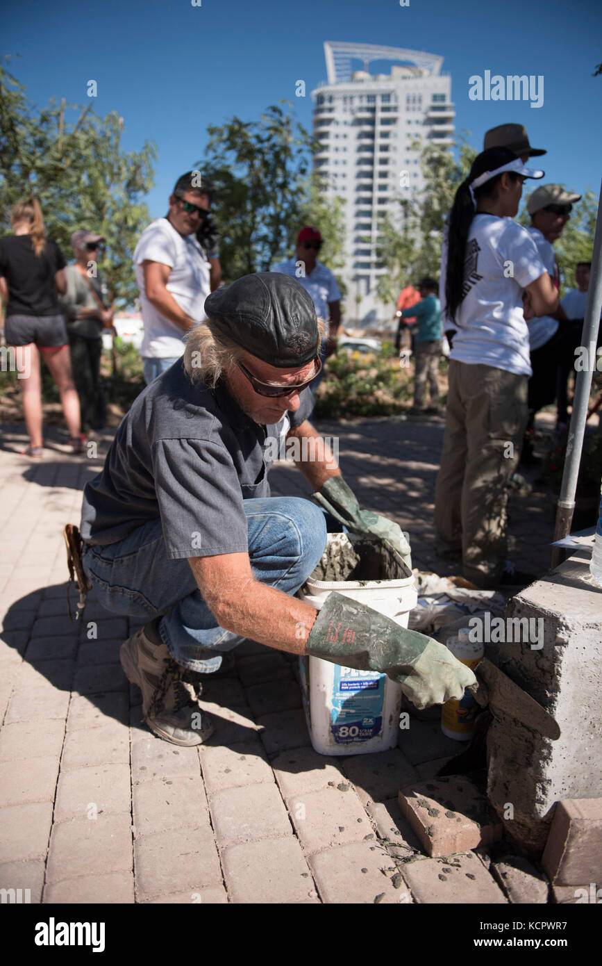 Las Vegas, USA. 6th Oct, 2017. On Oct. 6, 2017, in downtown Las Vegas, Nev., volunteer Lyle Hoffman works on the Las Vegas Community Healing Garden to commemorate the victims of the Route 91 Harvest Country Music Festival mass shooting. Credit: Jason Ogulnik/Alamy Live News Stock Photo