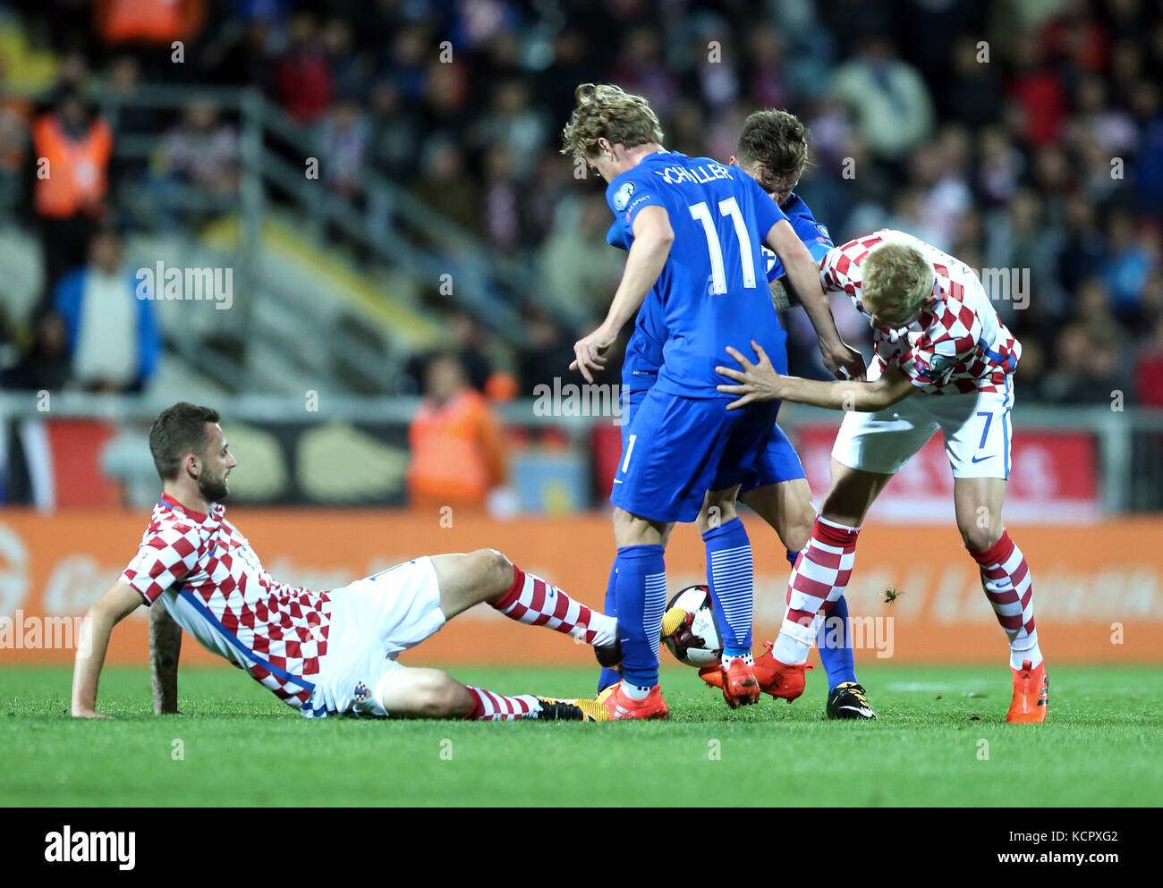 Rijeka. 6th Oct, 2017. Marcelo Brozovic (1st L) and Ivan Rakitic (1st R) of Croatia vie with Rasmus Schuller (2nd L) of Finland during 2018 FIFA World Cup Russia qualifiers match between Croatia and Finland in Rijeka, Croatia on Oct. 6, 2017. The match ended with a 1-1 draw. Credit: Sanjin Strukic/Xinhua/Alamy Live News Stock Photo