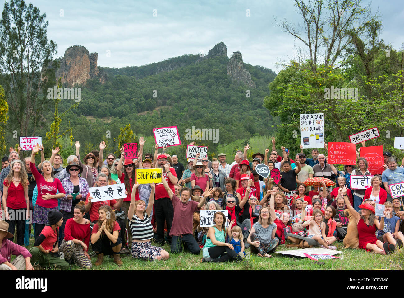 Nimbin, Australia. 7th October, 2017. Protesters against coal and Adani's Queensland Carmichael coal mine pose for photos in front of the sacred Nimbin Rocks. Credit: Peter Ptschelinzew/Alamy Live News. Stock Photo