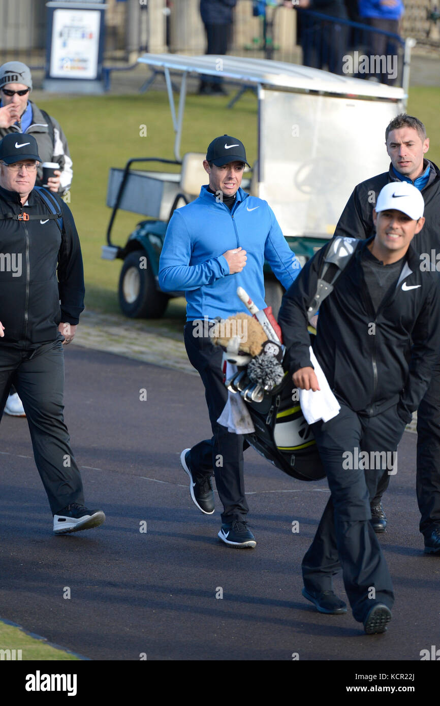 St Andrews, Scotland, United Kingdom. 07th Oct, 2017. Top golfer Rory McIlroy (C) heads for the tee on the Kingsbarns course at the start of his third round in the Alfred Dunhill Links Championship Credit: Ken Jack/Alamy Live News Stock Photo
