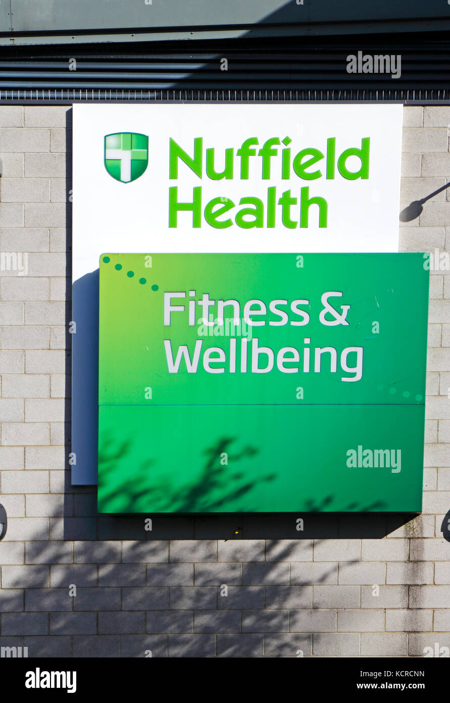 A sign for the Nuffield Health centre viewed from the Riverside Walk in Norwich, Norfolk, England, United Kingdom. Stock Photo