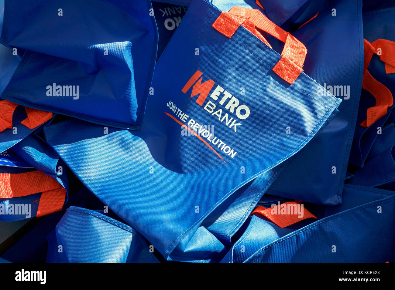 Metro Bank, Join The Revolution, blue bags. Stock Photo