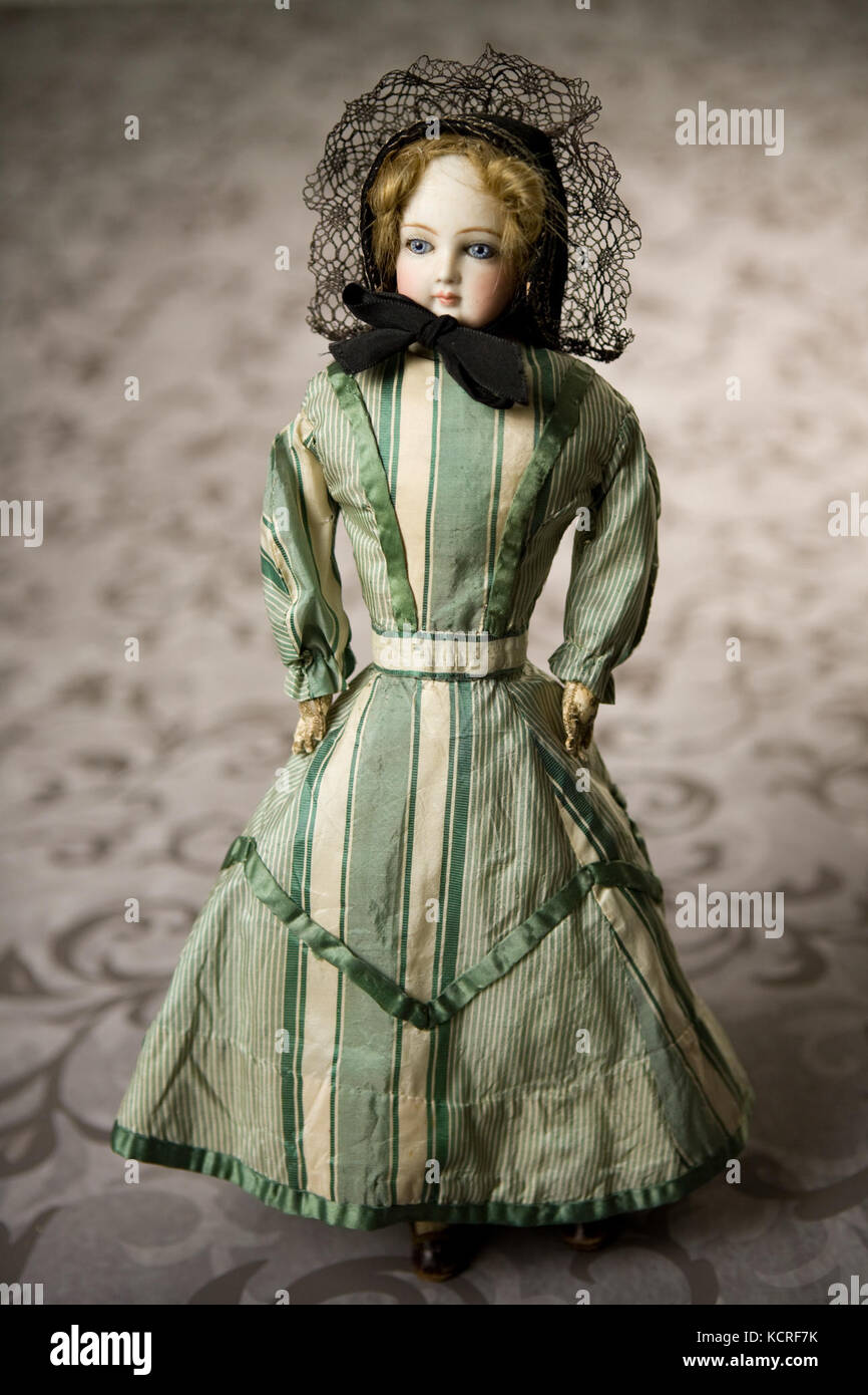 French Fashion Bisque Doll with Green and White Striped Dress Stock