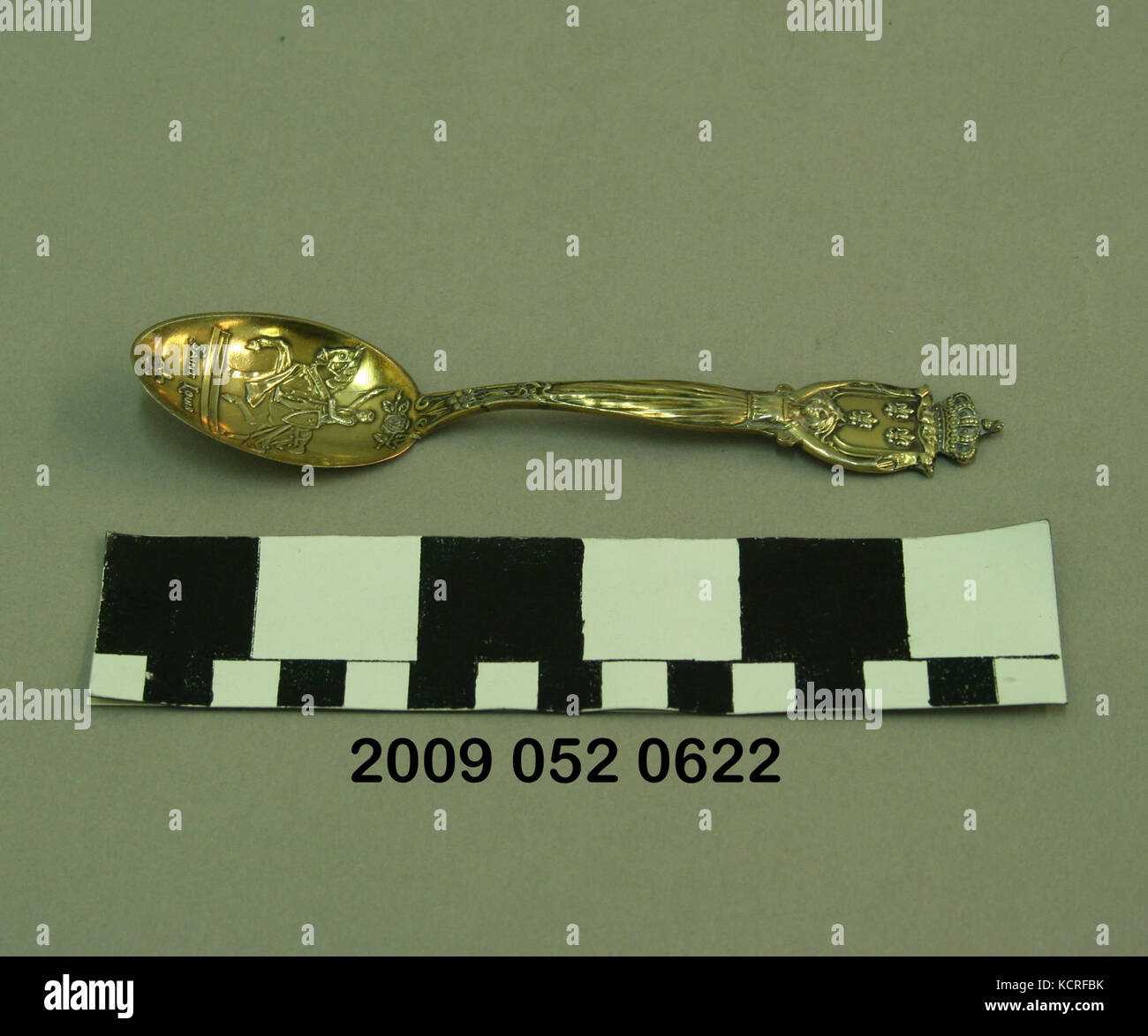 Gold Colored Silver Teaspoon By Mermod and Jaccard With Relief View of the Statue of St. Louis Riding a Horse Both in Full Armor in the Bowl Stock Photo