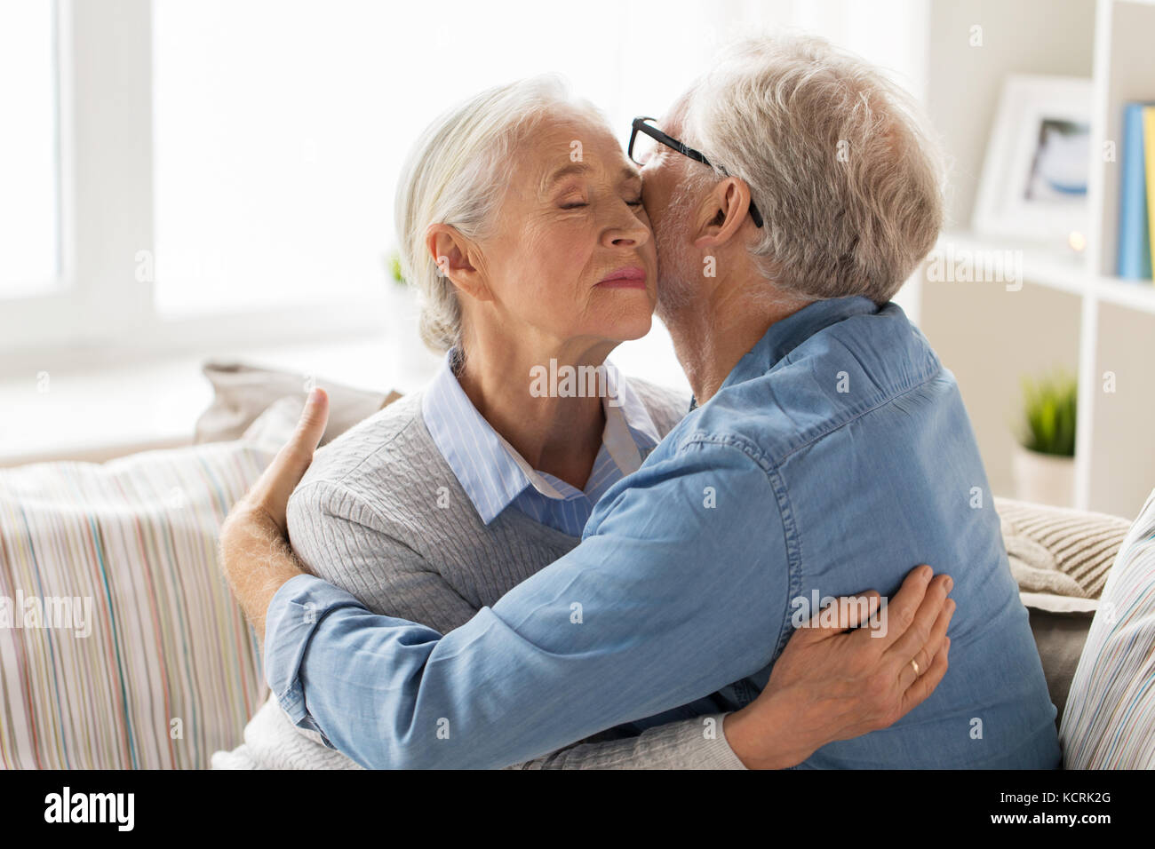 happy senior couple hugging at home Stock Photo - Alamy